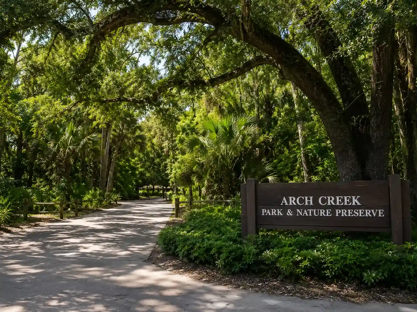 Arch Creek Park and Nature Preserve entrance surrounded by trees